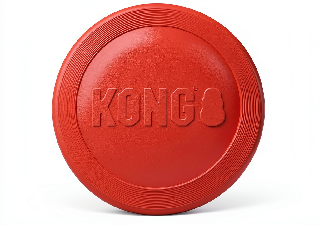 Kong Rubber Flyer being thrown in a park with a dog chasing it